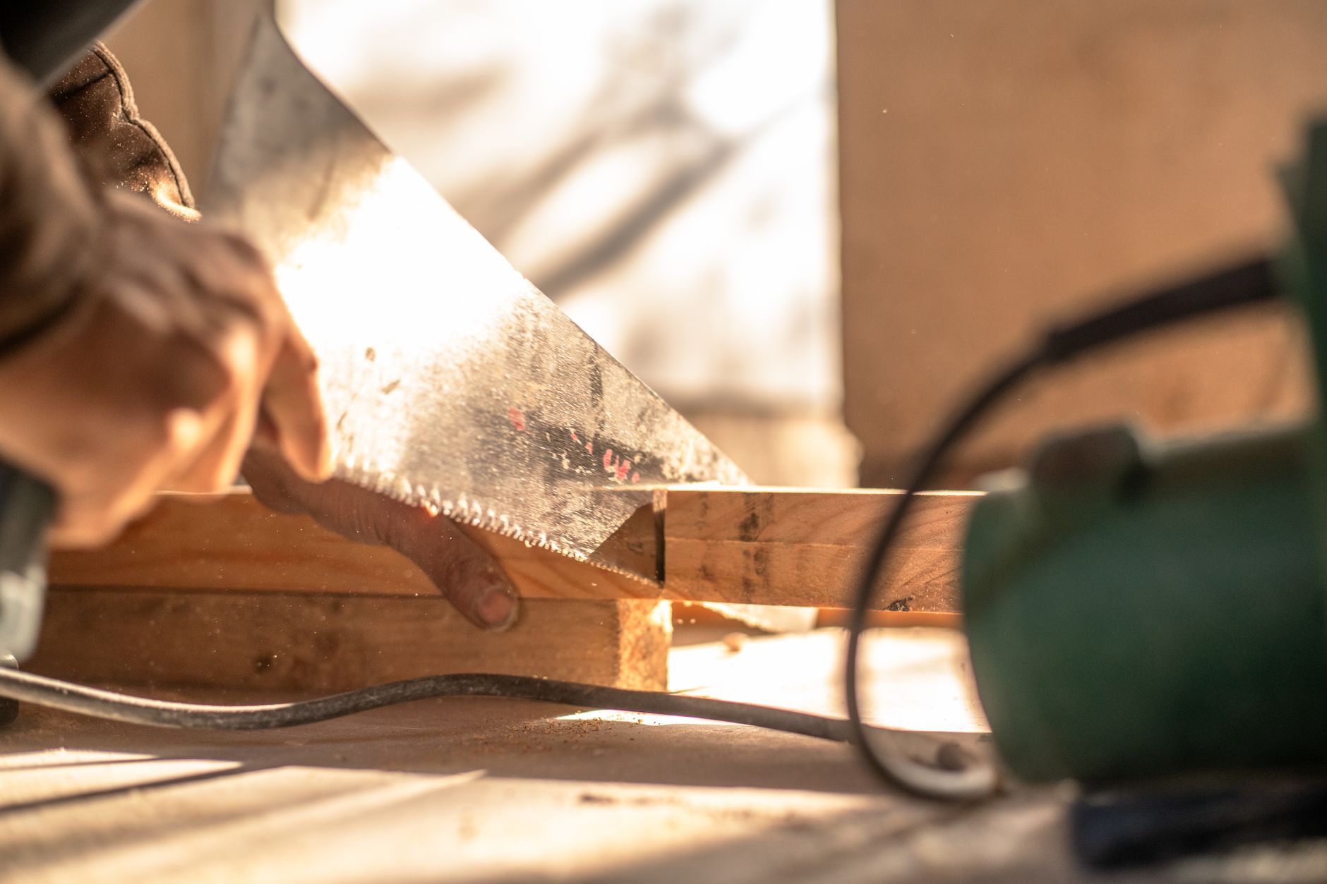 Step-by-step process of building a raised garden bed with wooden planks and soil preparation