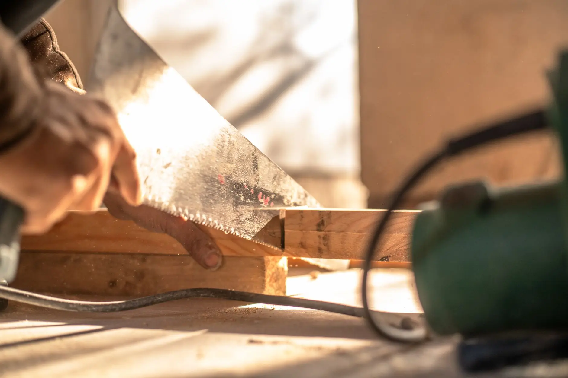 Step-by-step process of building a raised garden bed with wooden planks and soil preparation
